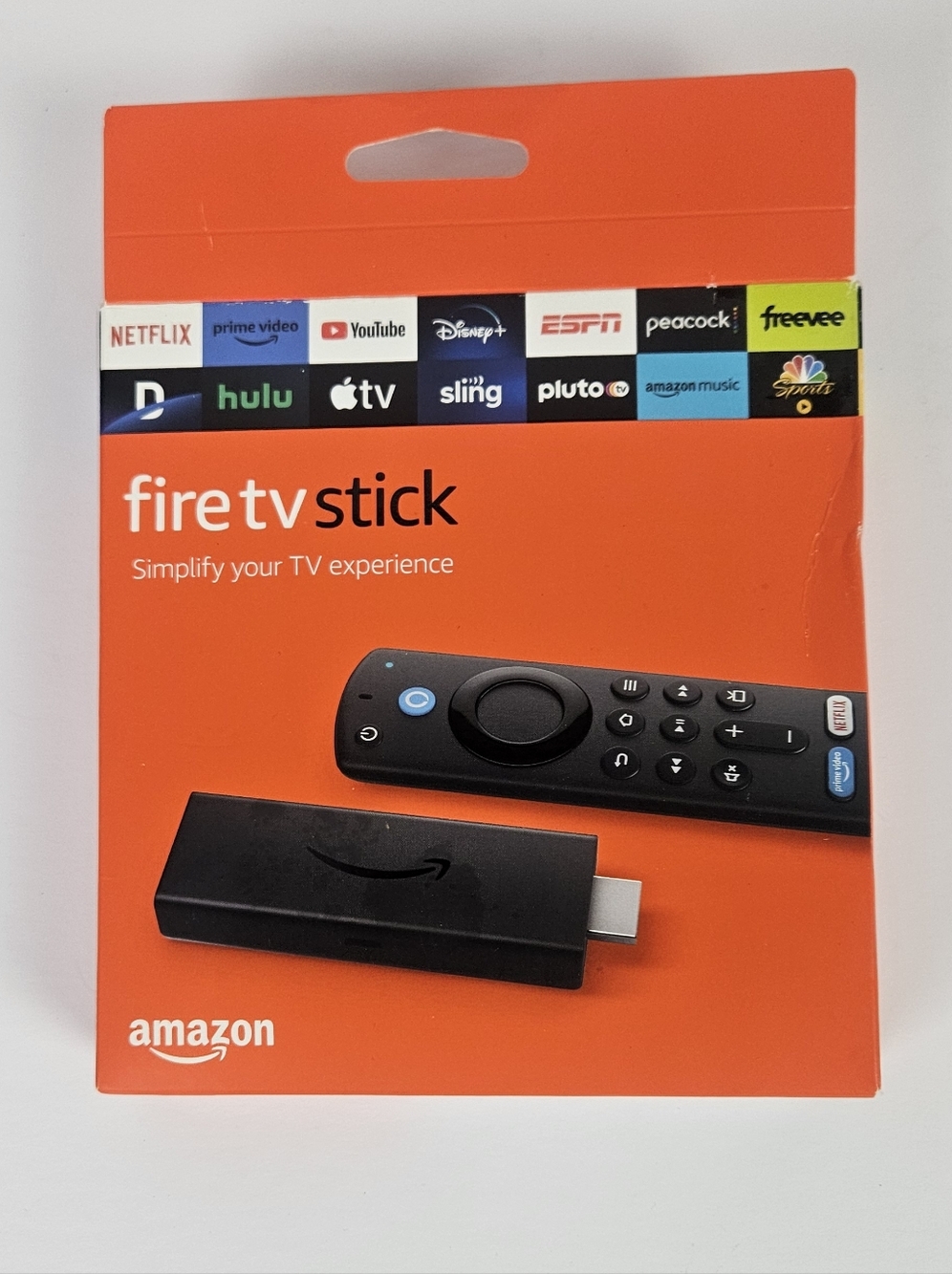 Amazon Fire TV Stick with Remote — Black on Orange Packaging